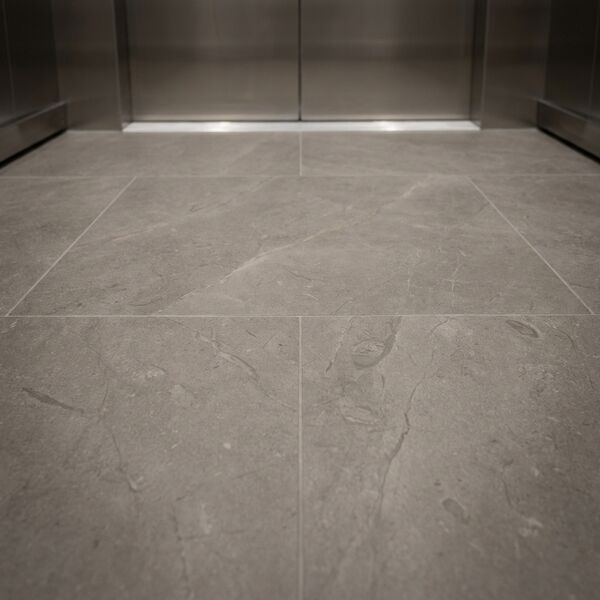 Bold contrast theme — granite-look floor detail with stainless trim
