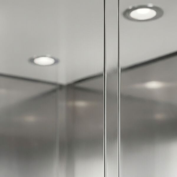 Contemporary theme — wall detail showing brushed stainless panel and reveal