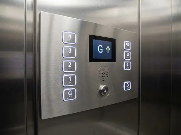 Modern stainless steel car operating panel with tactile Braille buttons and audible announcement speaker